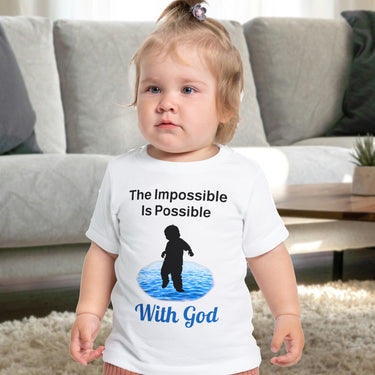 Bella+Canvas baby t-shirt with “Impossible Baby” design and faith-filled message, soft cotton, breathable and durable, Christian apparel for infants and family matching, baby in white shirt